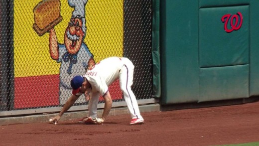 Wow: Jeff Francoeur whiffs his own throw from the outfield