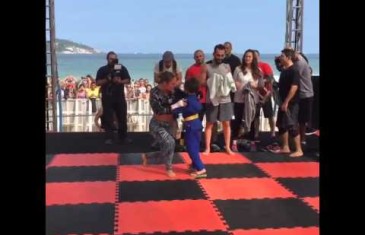 Cute: A young fan sprints over to Ronda Rousey for a hug