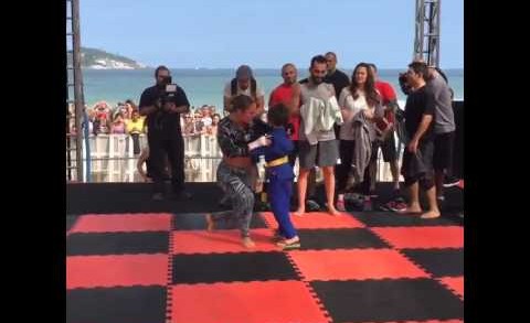 Cute: A young fan sprints over to Ronda Rousey for a hug