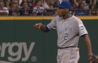 Omar Infante backhand flips to Alcides Escobar to make the throw to 1st