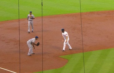 Stand Still: Adrian Beltre waits to tag out Gattis in the 2nd