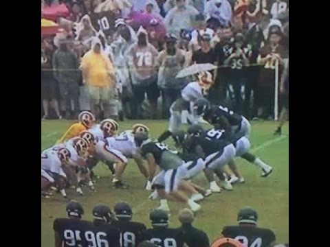 Disruptive Force: Vince Wilfork plows through Redskins offensive line