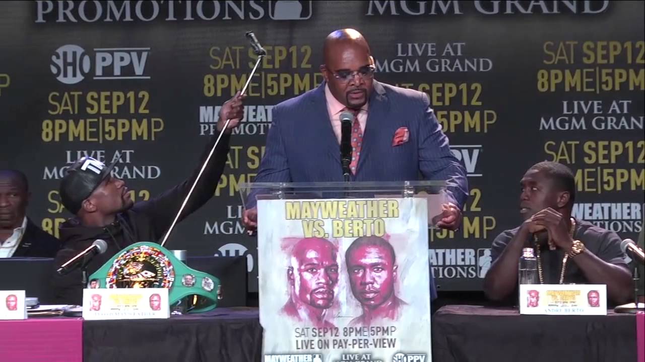 Floyd Mayweather takes a selfie on a selfie stick during press conference