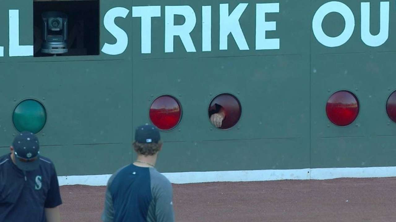 Red Sox break light on Green Monster in warmups