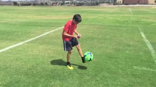 11 year old solves a rubik’s cube while doing keep ups with a soccer ball