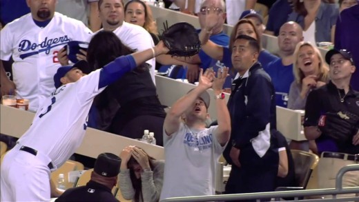 Fan fights with Adrian Gonzalez for a foul ball