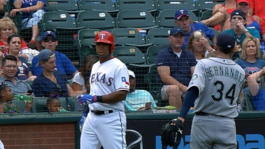 Felix Hernandez throws ball back to Adrian Beltre after liner