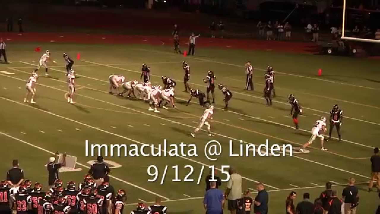 High school player rips off a player's helmet & hits him in the head with it