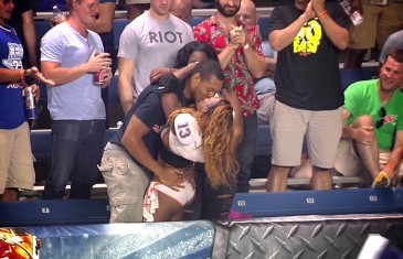 LFL player kisses a fan after scoring a touchdown