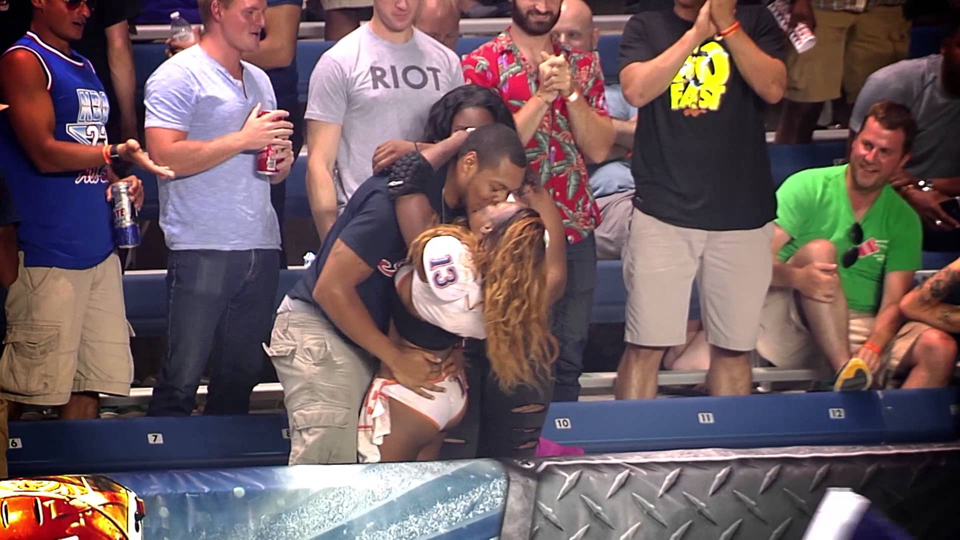 LFL player kisses a fan after scoring a touchdown