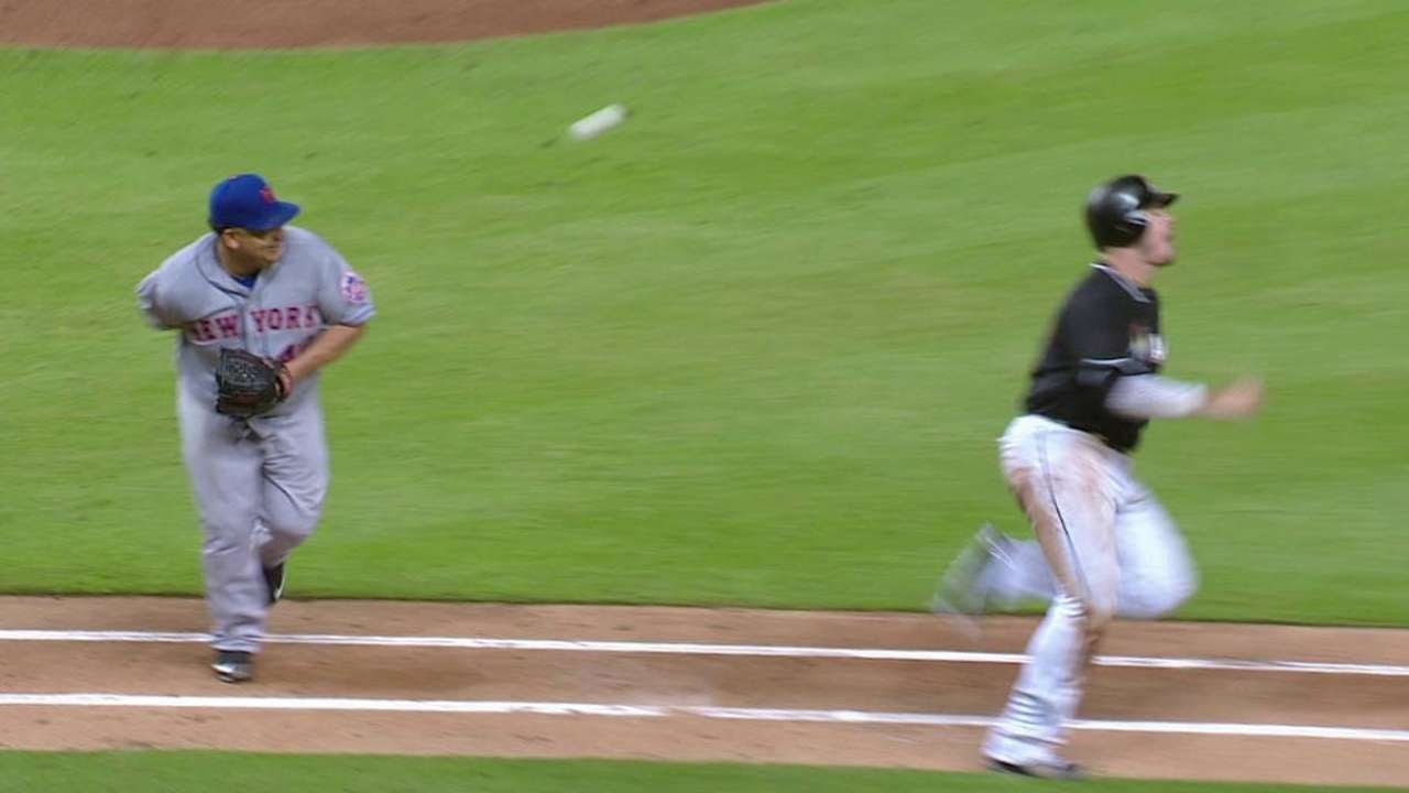 Mercy: Bartolo Colon makes a behind-the-back flip to record the out