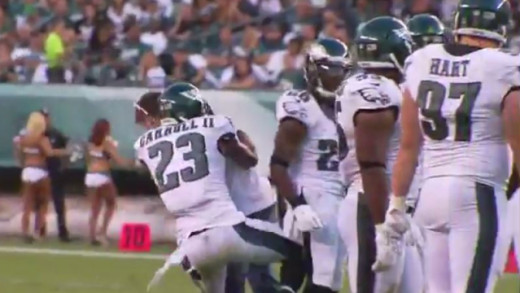 Eagles CB Nolan Carroll tackles a fan who runs onto the field