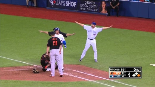 Troy Tulowitzki leaps over catcher Matt Wieters to avoid tag at 1st Base