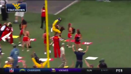 West Virginia WR Shelton Gibson plows through Maryland cheerleaders after TD
