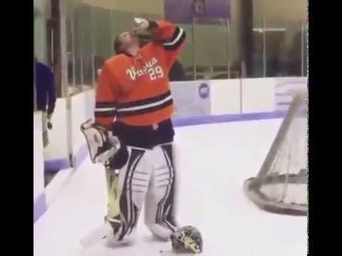 Virgina hockey goalie chugs a beer while on the ice & gets ejected