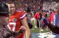 Cop dances with Florida Gators safety Keanu Neal on sidelines
