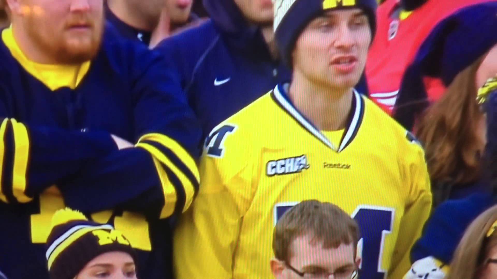 Angry Michigan fan flips off the camera