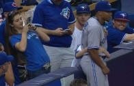 Ben Revere takes photo with young Blue Jays fan in the stands