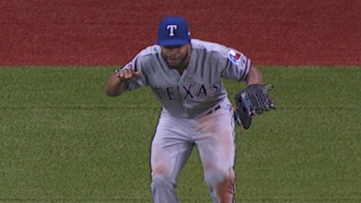 Delino DeShields does some housekeeping in the outfield