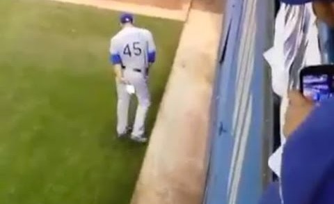 Derek Holland wipes his rear with a Blue Jays rally towel