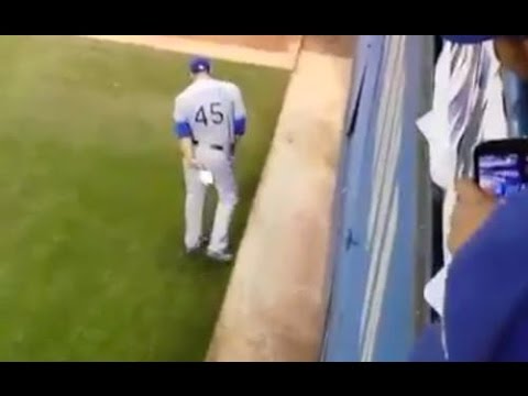Derek Holland wipes his rear with a Blue Jays rally towel