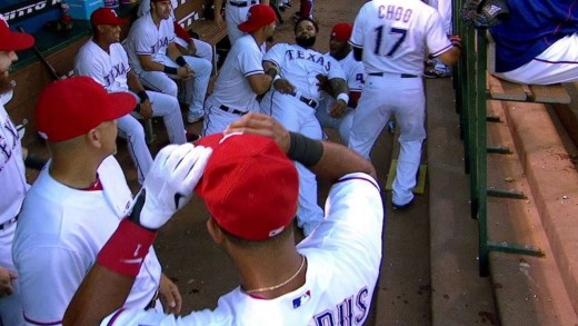 Elvis Andrus jokes around with Prince Fielder in the dugout