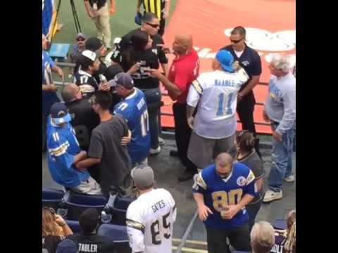 Oakland Raiders fan & San Diego Chargers fan separated by security