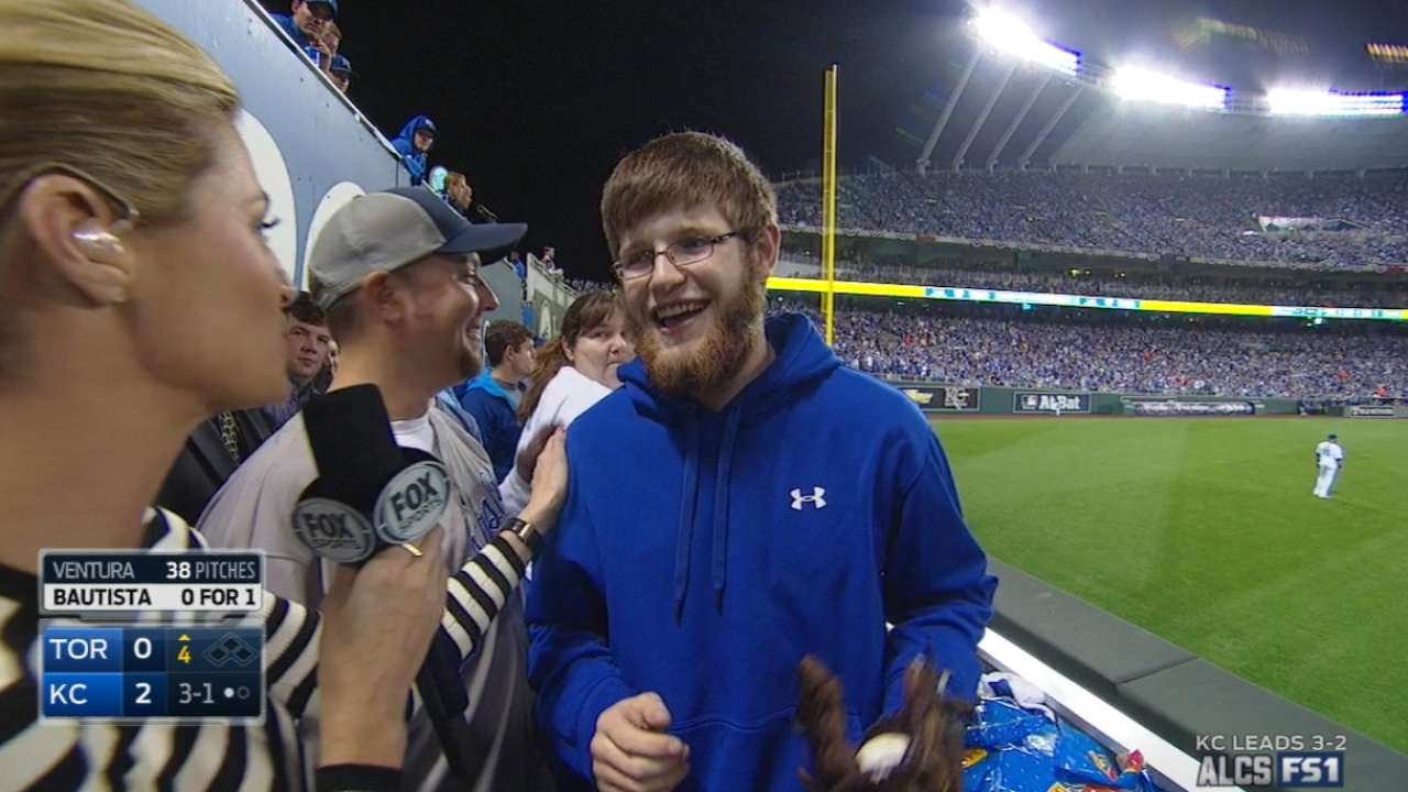 Royals fan discusses reaching for Moustakas' homer