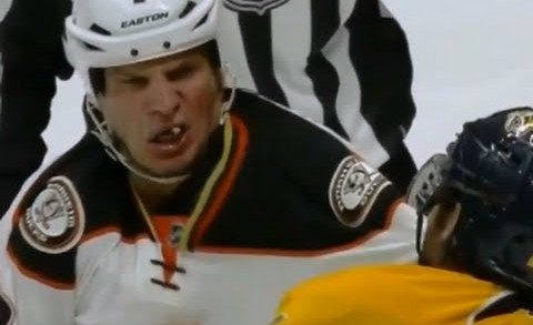 Anaheim Ducks defenceman Kevin Bieksa loses a tooth during fight