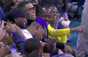 Cam Newton hits a dab after LeBron James throws it down
