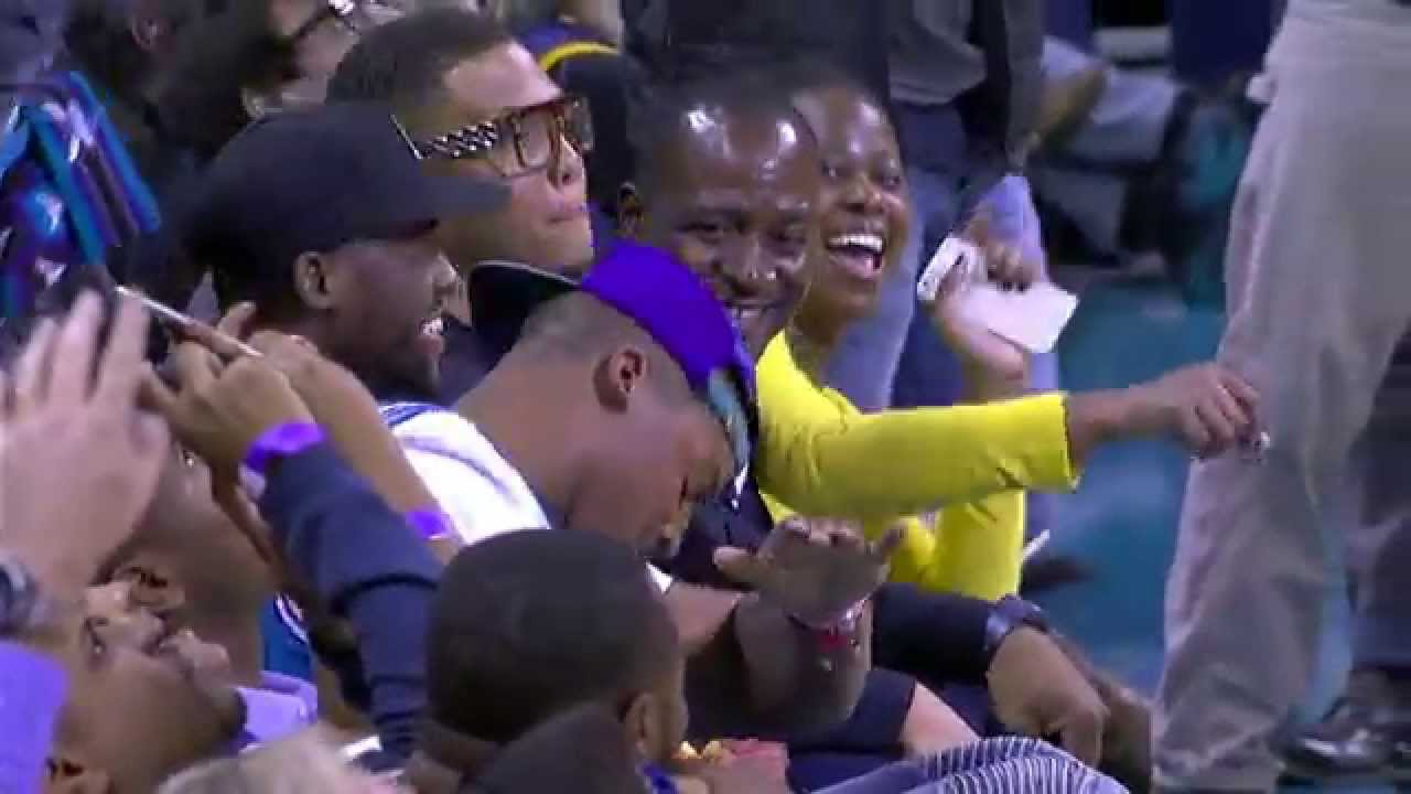 Cam Newton hits a dab after LeBron James throws it down