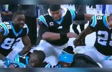 Cam Newton & Panthers teammates do a team “dab”