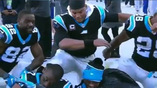 Cam Newton & Panthers teammates do a team “dab”