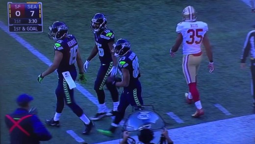 Doug Baldwin drilled by Eric Reid before he can score TD