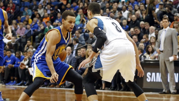 Steph Curry hits a 3-pointer even with Andre Miller getting a hand on it