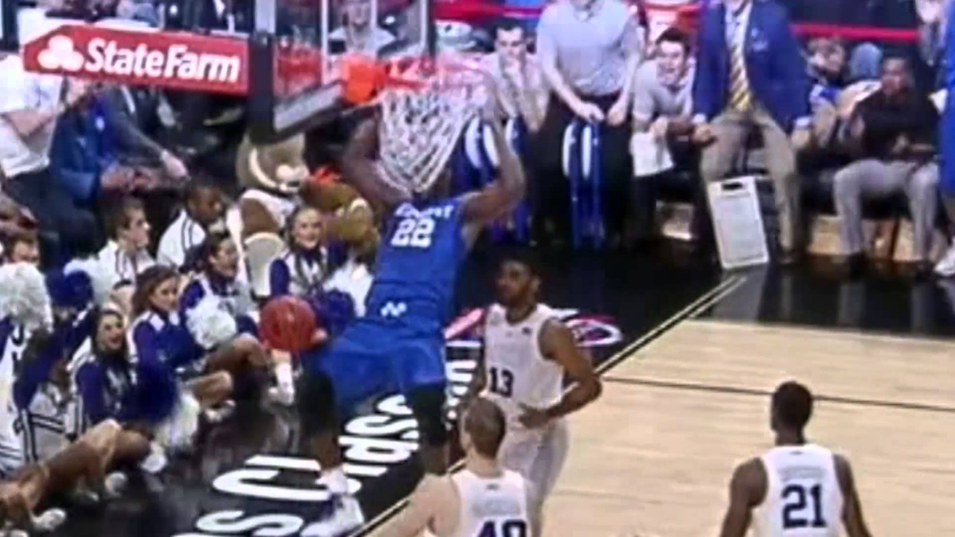 Kentucky basketball player Alex Poythress gets his teeth stuck in the net