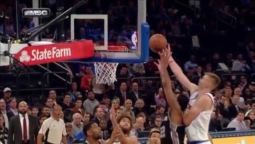 Kristaps Porzingis rises over LaMarcus Aldridge for the putback slam