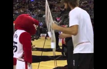 Robin Lopez drills the Raptors mascot with a sign