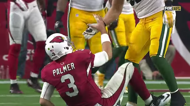 Clay Matthews pulls hand away on help up to Carson Palmer