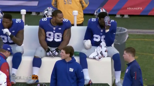 Giants DE Jason Pierre Paul struggles to put on his glove