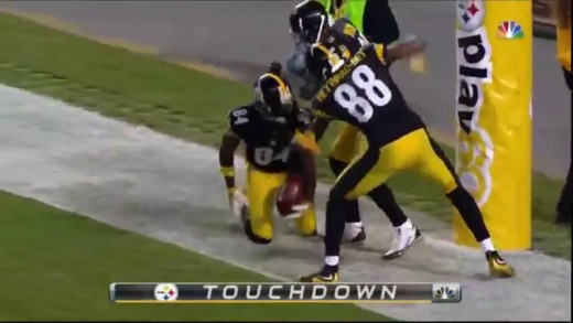 Antonio Brown violates a goal post after punt return TD