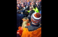 Broncos fan slams a Raiders fan on his head