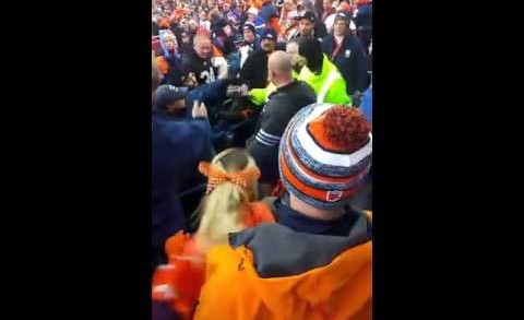 Broncos fan slams a Raiders fan on his head