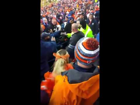 Broncos fan slams a Raiders fan on his head