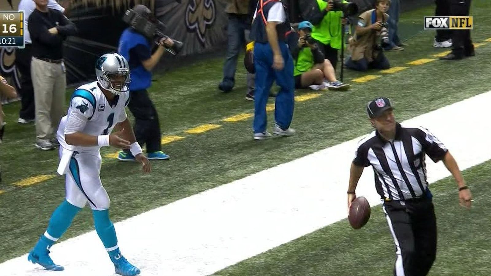 Ref tries to stop Cam Newton from giving TD ball to a fan