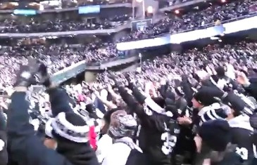Charles Woodson throws up the “O” causing section of Raiders fans to do the same