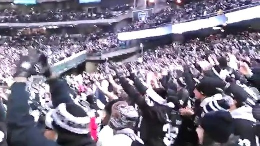 Charles Woodson throws up the “O” causing section of Raiders fans to do the same