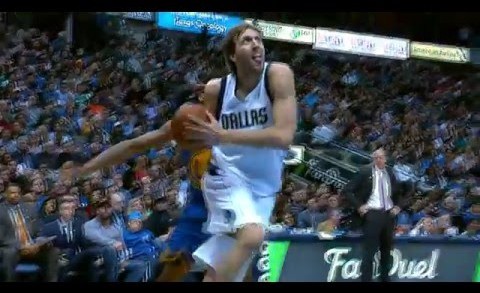 Dirk Nowitzki throws down the rare slam dunk