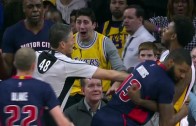 Nick Young gives a forearm to the face of Anthony Tolliver after foul