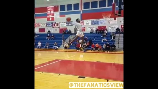 High school senior JaShaun Smith throws down windmill from free throw line